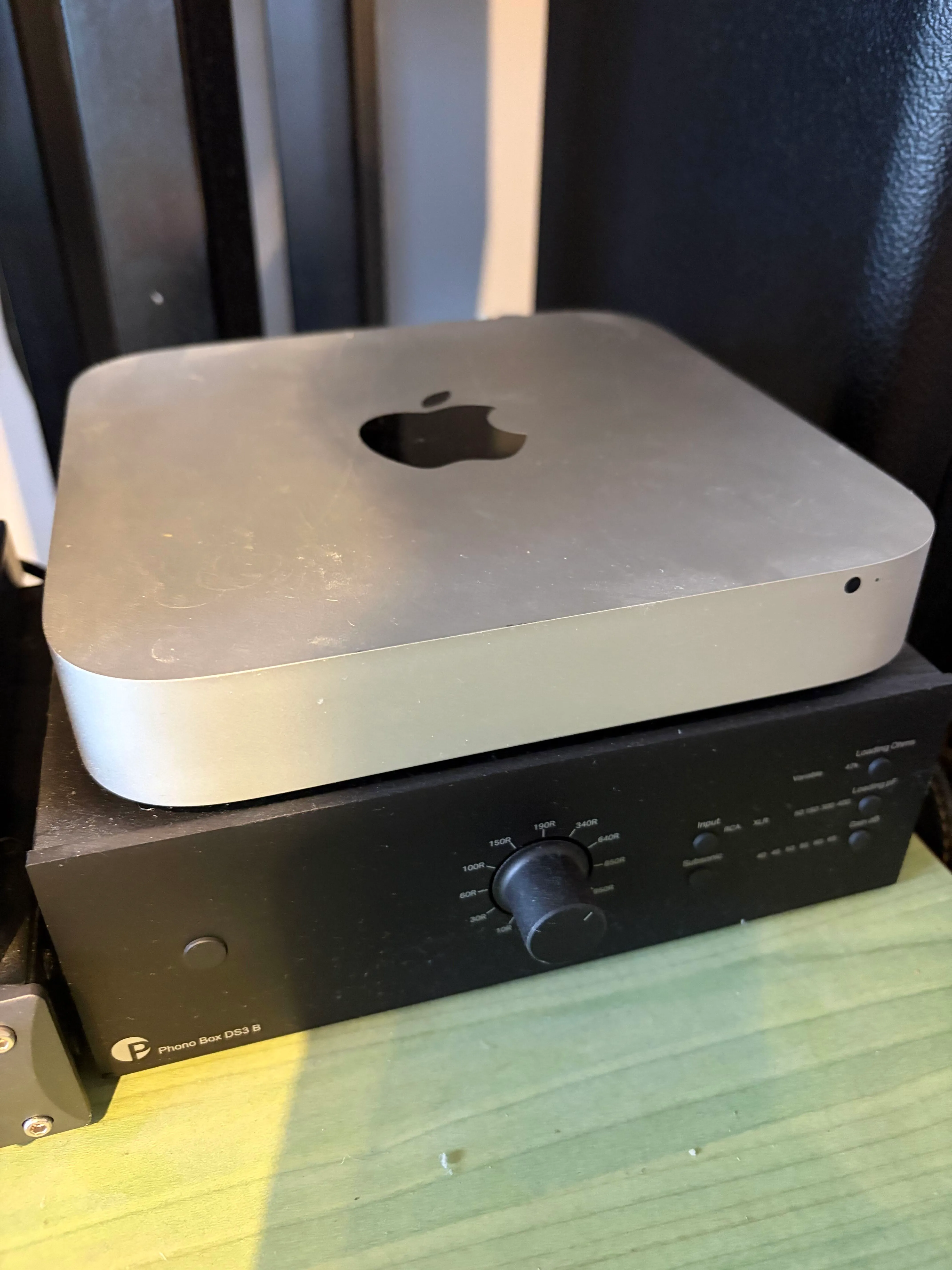 An Intel Mac mini resting on top of a Pro-Ject Phono Box DS3 B phono
preamplifier